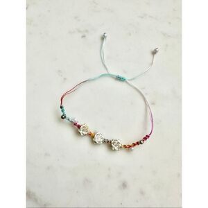 Rainbow braided lotus flower friendship bracelet